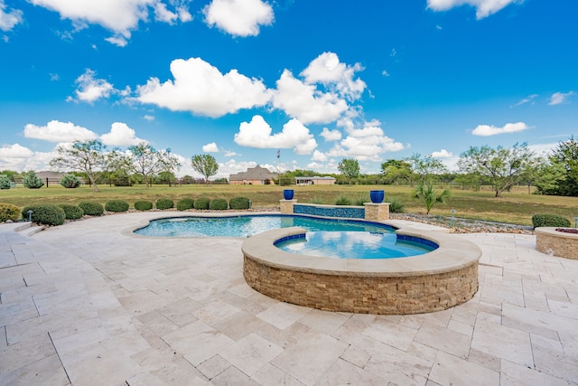 view of swimming pool featuring a yard, a patio area, and an in ground hot tub