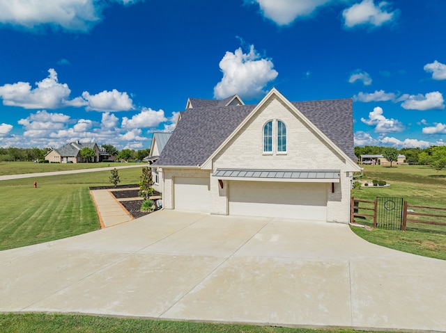 exterior space featuring a garage and a front yard