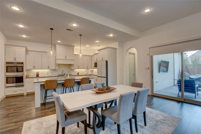 dining space featuring dark hardwood / wood-style flooring