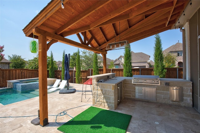 3203 Prancer Way, Celina, TX 75009 - view of patio / terrace featuring outdoor wet bar, a pool with connected hot tub, an outdoor kitchen, area for grilling, and a fenced backyard