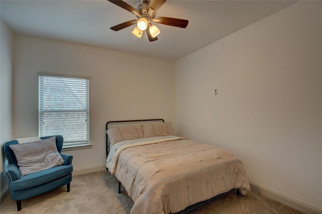 bedroom featuring ceiling fan and light carpet