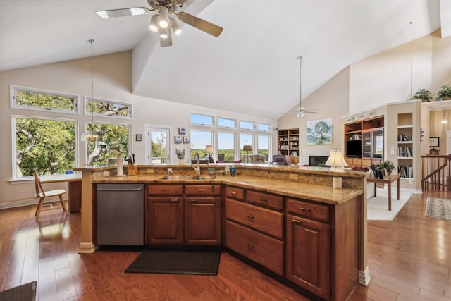 kitchen with high vaulted ceiling, ceiling fan, hanging light fixtures, dark hardwood / wood-style floors, and stainless steel dishwasher