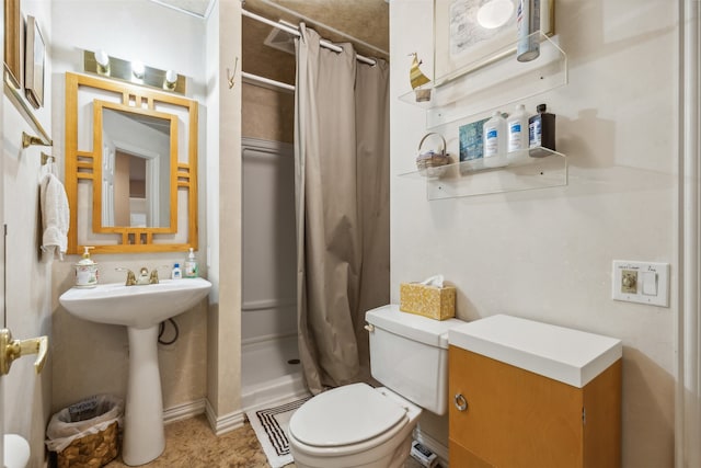 bathroom with walk in shower and toilet