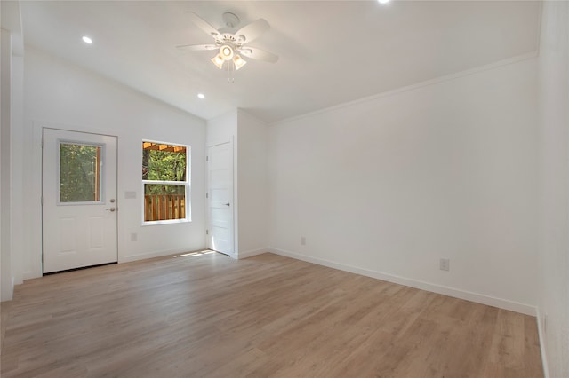 unfurnished room featuring ceiling fan, vaulted ceiling, and light hardwood / wood-style flooring