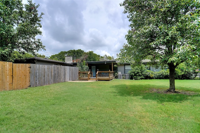 view of yard with a wooden deck