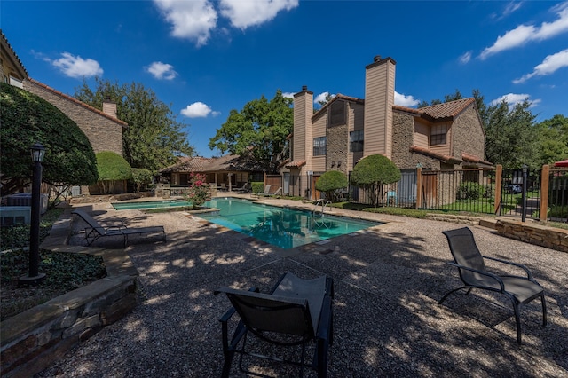 view of swimming pool with a patio