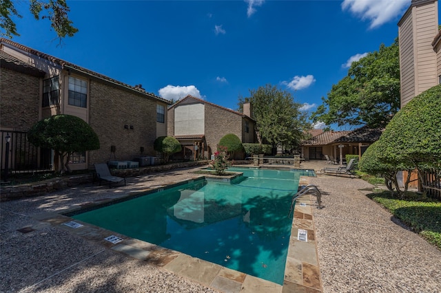 view of swimming pool featuring a patio area