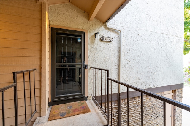 property entrance with a balcony