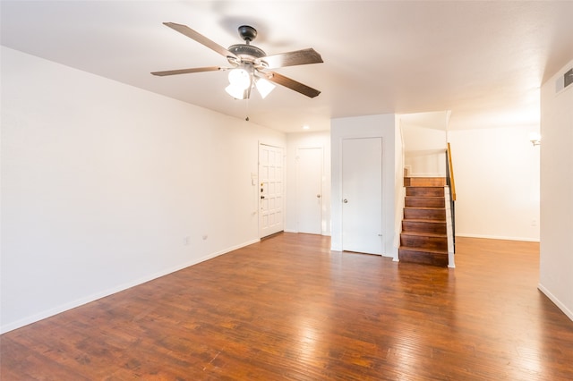 spare room featuring ceiling fan and dark hardwood / wood-style flooring