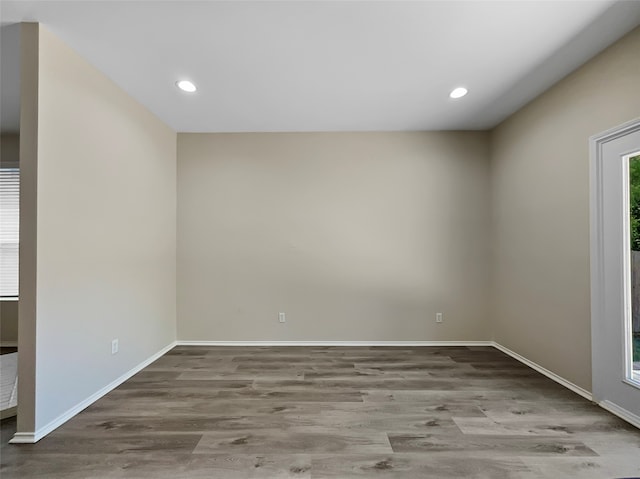 spare room with hardwood / wood-style floors