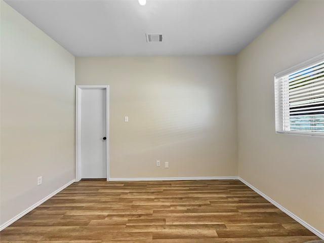 spare room featuring hardwood / wood-style flooring