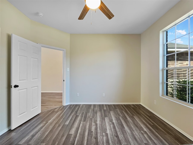 empty room featuring hardwood / wood-style floors and ceiling fan