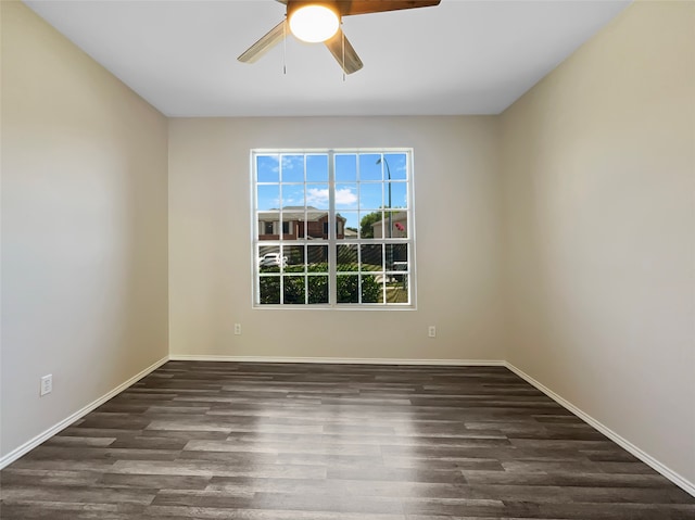 unfurnished room with dark wood-type flooring and ceiling fan