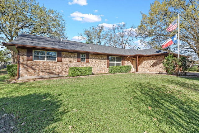 ranch-style home with a front lawn