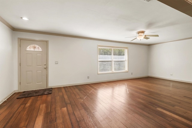 foyer with ceiling fan, ornamental molding, and dark hardwood / wood-style flooring