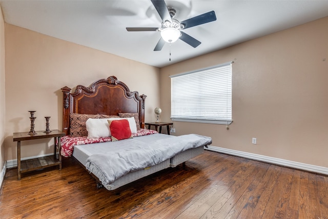 bedroom featuring ceiling fan and dark wood-type flooring