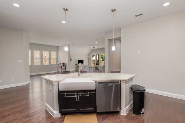 kitchen featuring dishwasher, a kitchen island with sink, hanging light fixtures, and sink