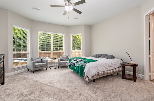 bedroom with ceiling fan and carpet flooring