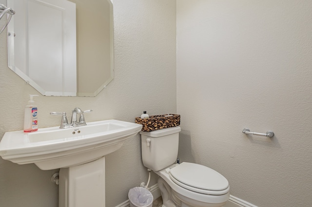 bathroom with toilet and sink