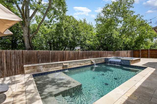 view of pool featuring an in ground hot tub, a patio, and pool water feature