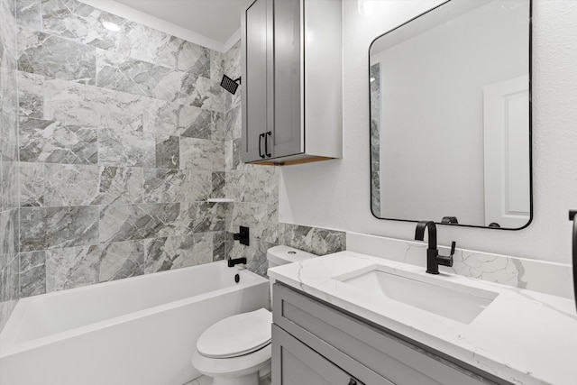 full bathroom with tiled shower / bath combo, toilet, and vanity