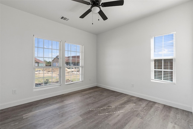 empty room featuring wood-type flooring and ceiling fan