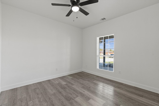 spare room featuring ceiling fan and wood-type flooring