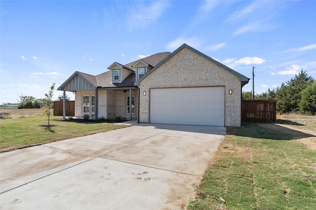 view of front of house featuring a garage and a front yard