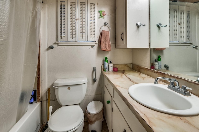 full bathroom featuring shower / bath combination with curtain, vanity, and toilet