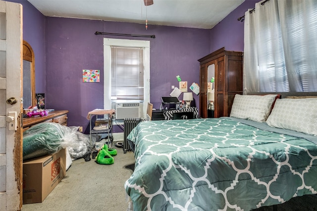 bedroom with carpet flooring, ceiling fan, and cooling unit