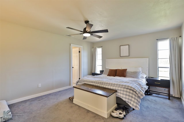 bedroom with ceiling fan and carpet floors