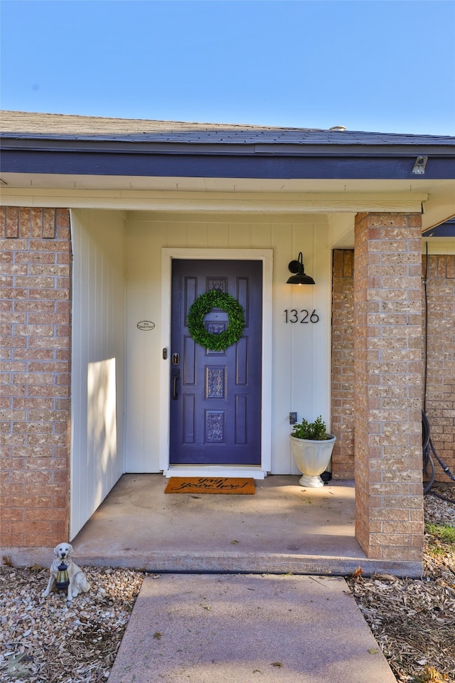 doorway to property featuring covered porch