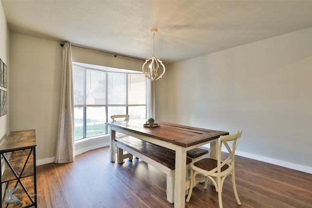 dining room featuring a chandelier and dark hardwood / wood-style flooring