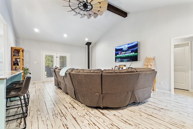 living room with light hardwood / wood-style flooring, french doors, beam ceiling, high vaulted ceiling, and ceiling fan