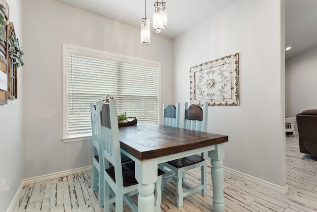 dining area featuring light wood-type flooring