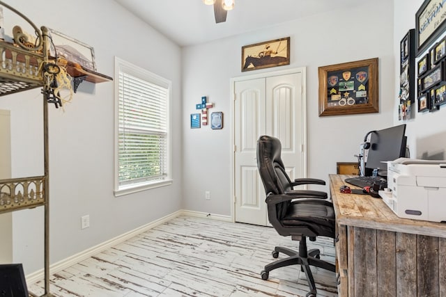 office space with light wood-type flooring and ceiling fan