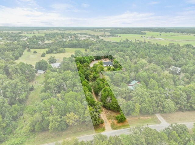 birds eye view of property with a rural view