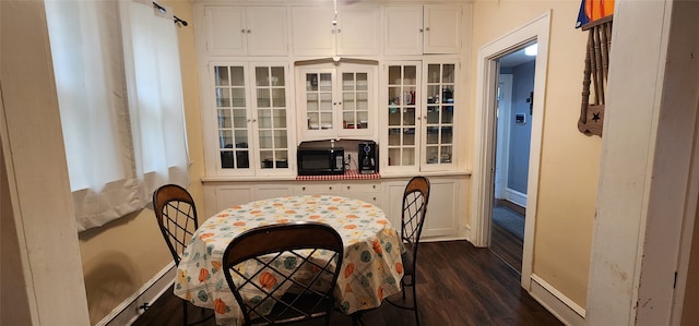 dining room featuring dark wood-type flooring