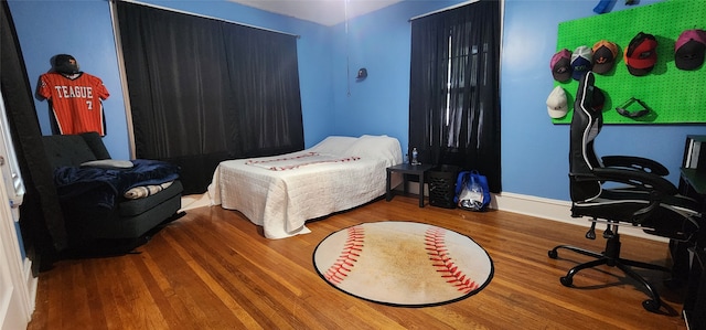 bedroom featuring wood-type flooring