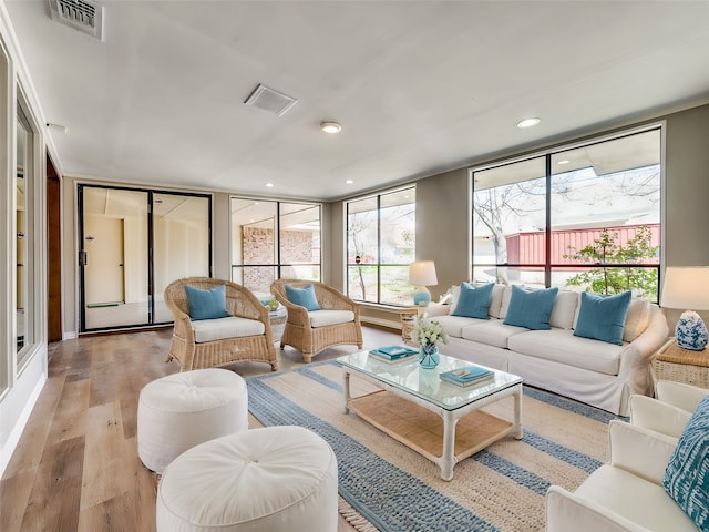 living room with light hardwood / wood-style flooring