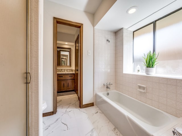 bathroom with shower with separate bathtub and vanity