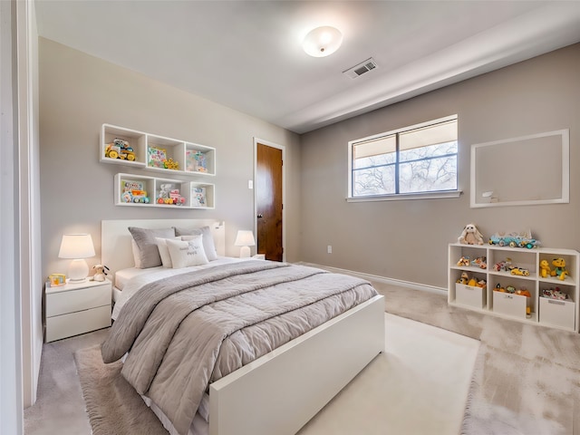 bedroom with light carpet