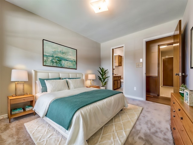 carpeted bedroom with ensuite bathroom