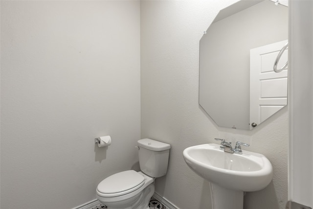 bathroom with toilet and sink