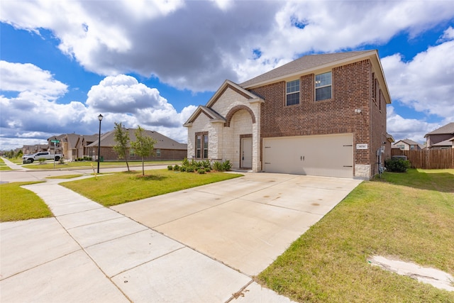 view of front of house with a garage and a front yard