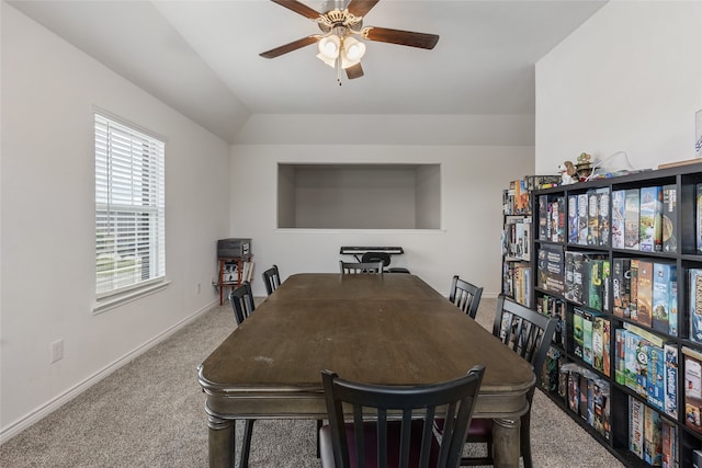 dining room featuring light colored carpet and ceiling fan