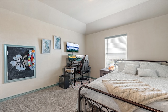 bedroom with vaulted ceiling and carpet flooring