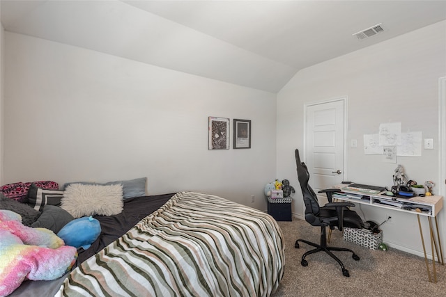 bedroom with carpet and vaulted ceiling