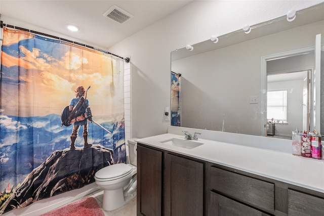 bathroom featuring tile patterned floors, a shower with curtain, toilet, and vanity