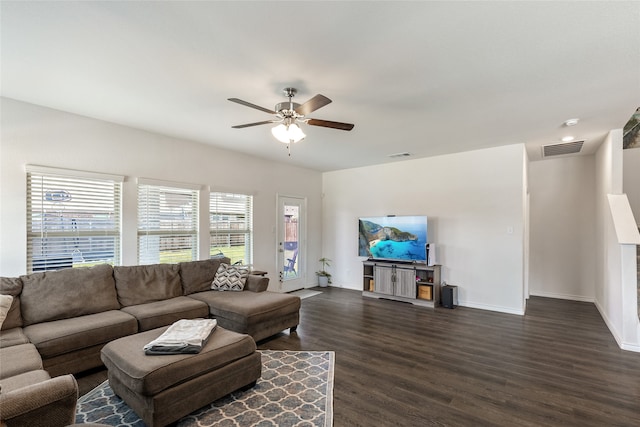 living room featuring dark hardwood / wood-style flooring and ceiling fan